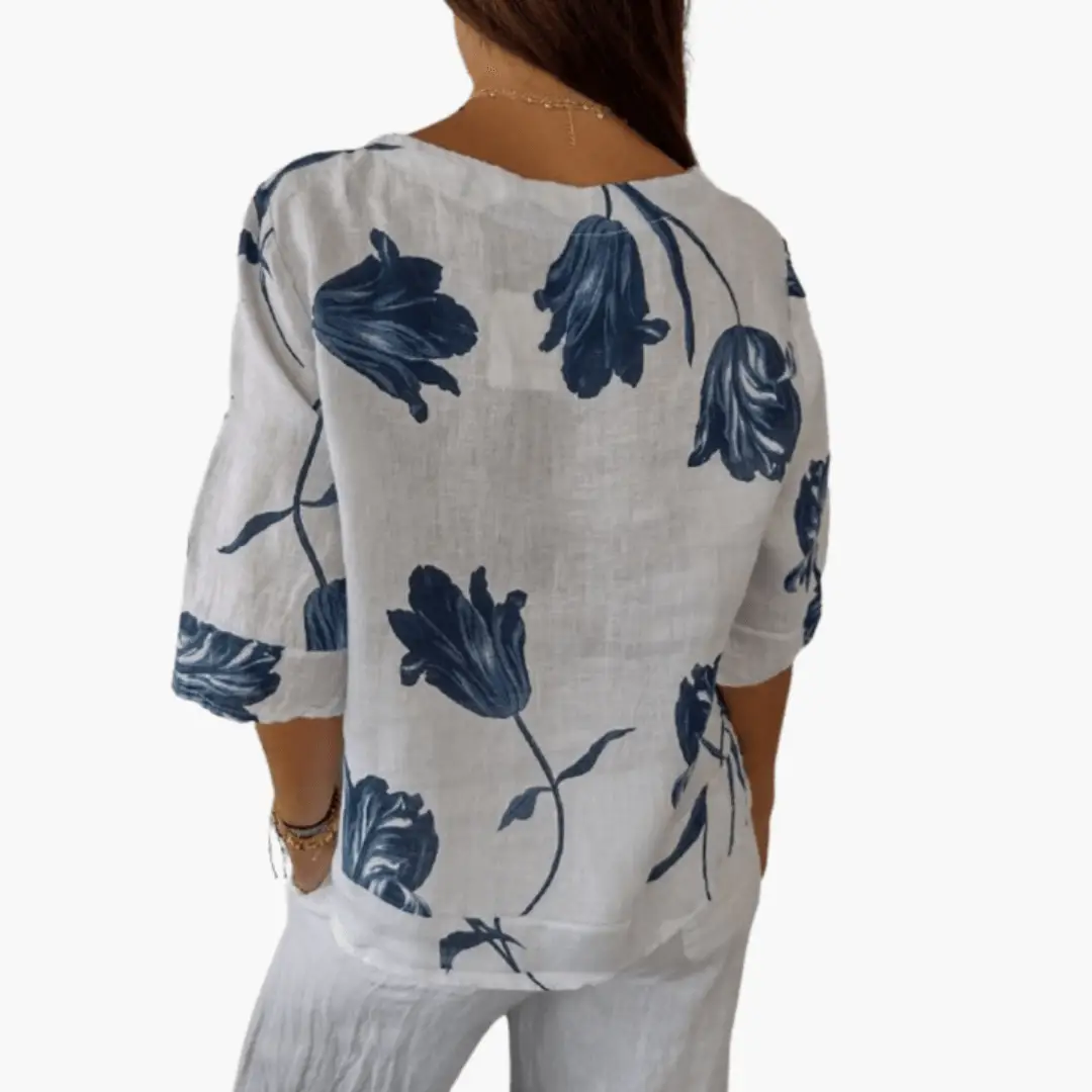 Women's floral print blouse in white with navy blue flowers, 3/4 sleeves, back view