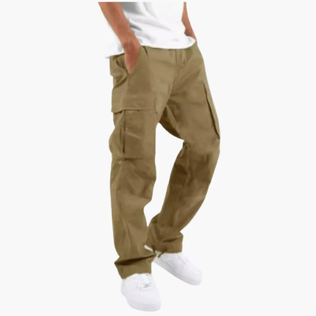 Men’s cargo pants with wide legs in tan, multiple pockets, worn with white sneakers.
