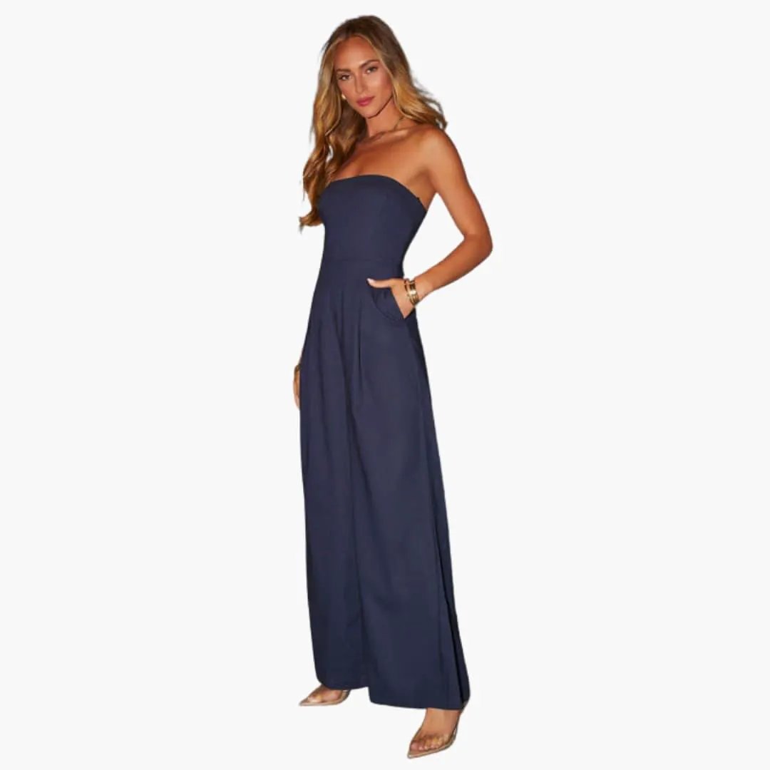 Jumpsuit for women in navy with strapless neckline, wide-leg pants and pockets.