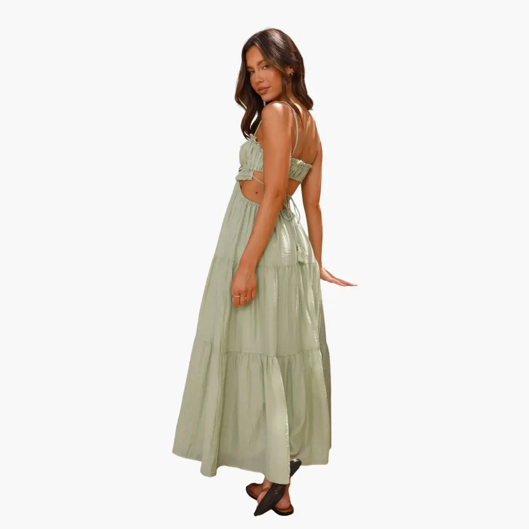 Maxi dress in sage green with boho details, spaghetti straps, back tie, and tiered skirt