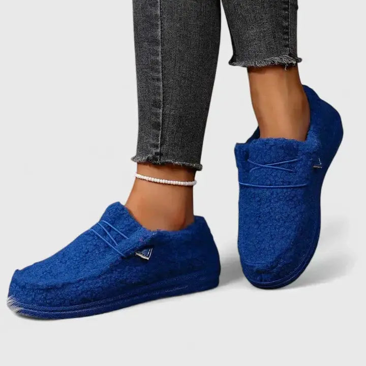 Pair of women's orthopedic loafers by Wilfred Smith in blue with cushioned footbed and flexible fit