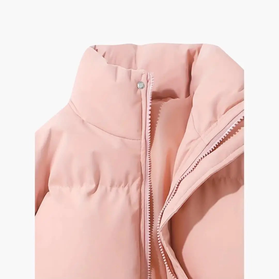 Women's hooded jacket in pale pink, quilted puffer with front zipper and visible exterior stitching.