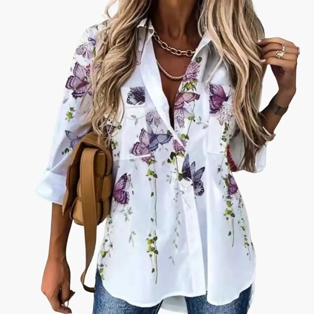 Blouse with floral butterfly print on white, casual women's shirt with rolled sleeves and front pockets