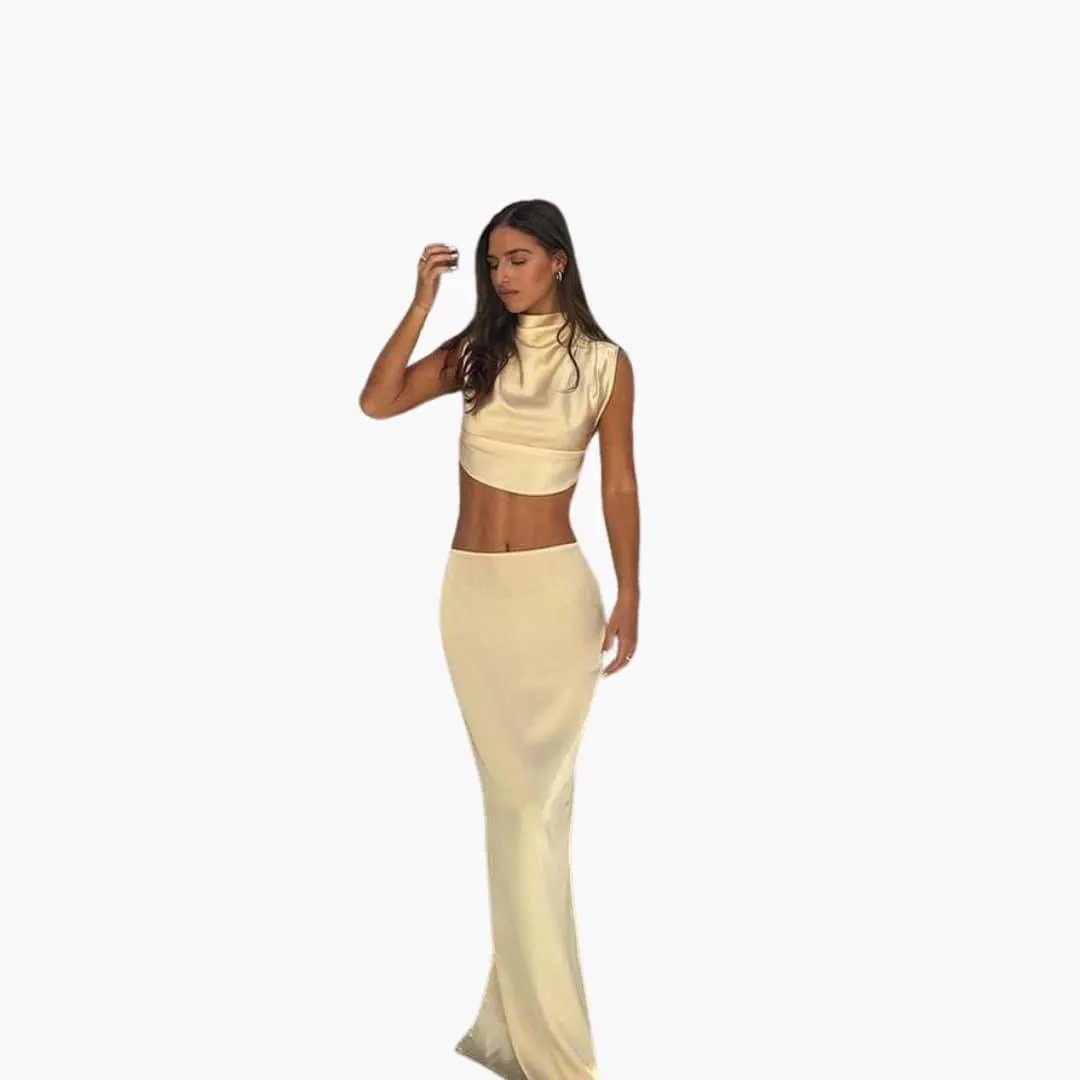 Two-piece satin set for women by Wilfred Smith—cropped blouse with champagne pants.