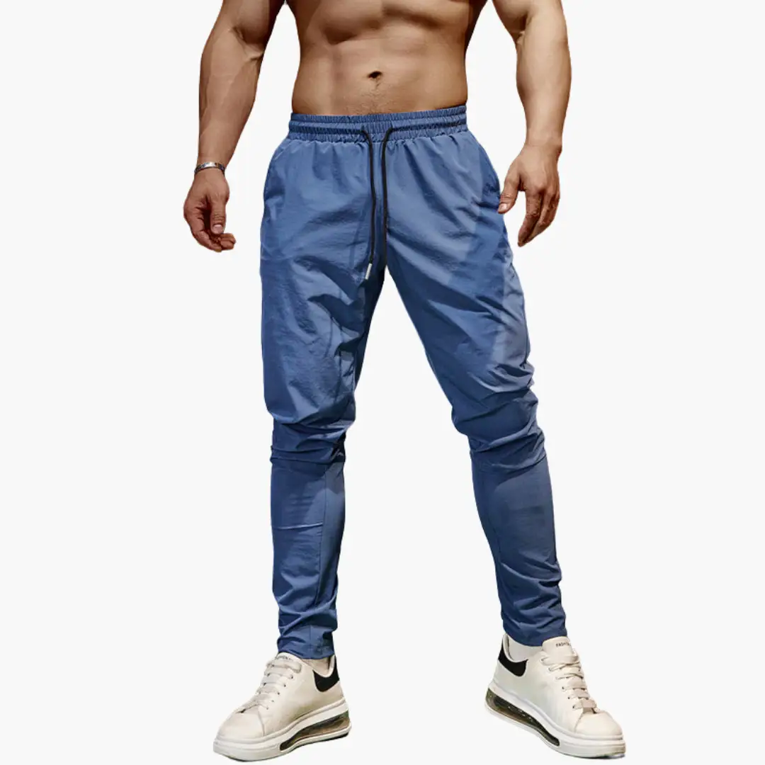 Men's blue gradient jogging pants with elastic waistband and drawstring, tapered cuffs