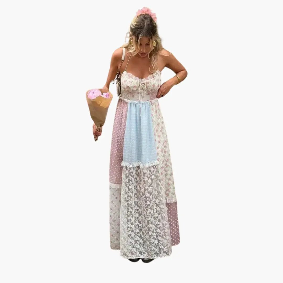 Patchwork maxi dress with spaghetti straps featuring pastel lace panels, worn by a model holding a bouquet.