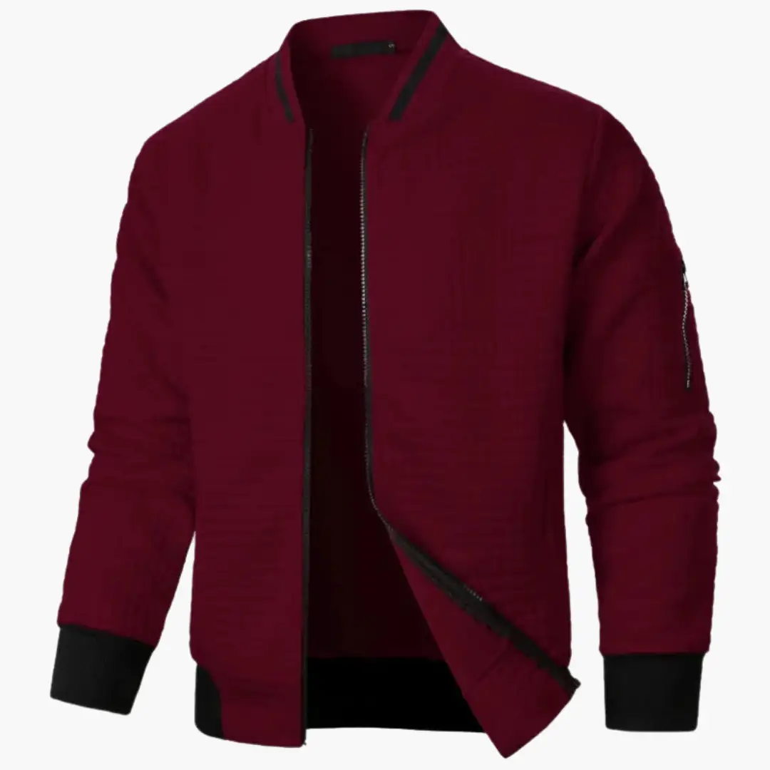 Men's burgundy bomber jacket with black ribbed cuffs and hem, front zipper, and sleeve zip pocket.