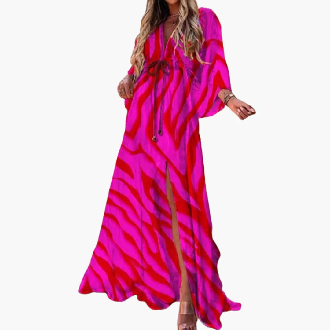 Women's maxi dress in bright pink with zebra-like magenta stripes, long sleeves, front slit
