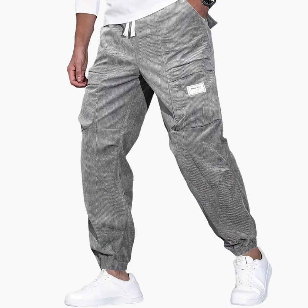 Men's corduroy trousers in gray with waistband, side pockets, cargo pocket, drawstring waist, cuffs, Wilfred Smith.