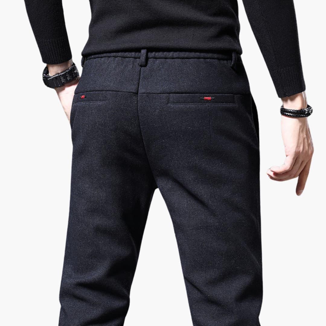 Wilfred Smith men's casual trouser in dark navy fabric; rear pockets with red stitch detail.