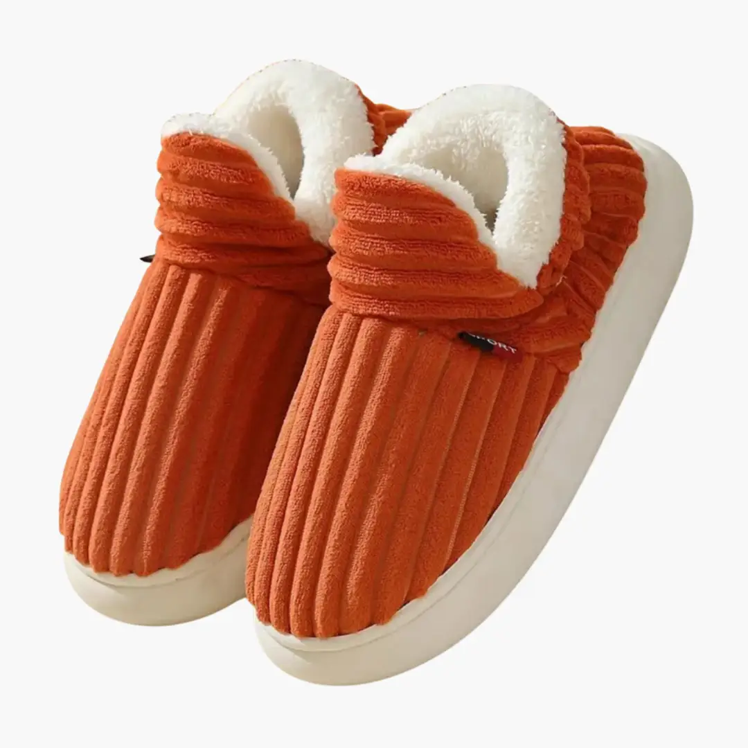 Women's slippers with rust-orange ribbed plush exterior and white fluffy inner lining