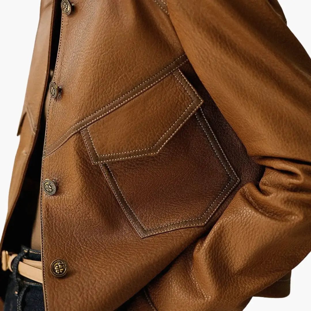 Women's brown jacket with long sleeves featuring a stitched patch pocket and metal buttons