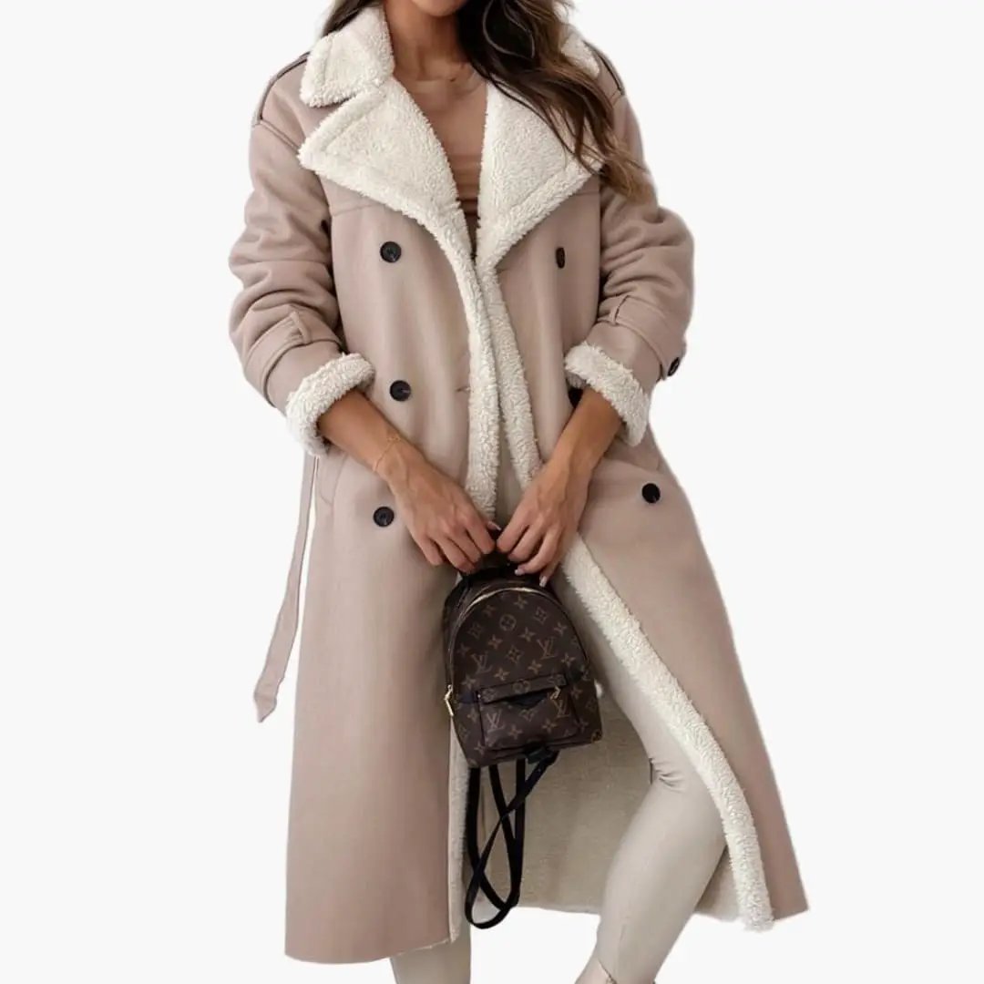 Women's long coat with notched collar and faux fur lining in beige; shearling trim and a Louis Vuitton backpack.