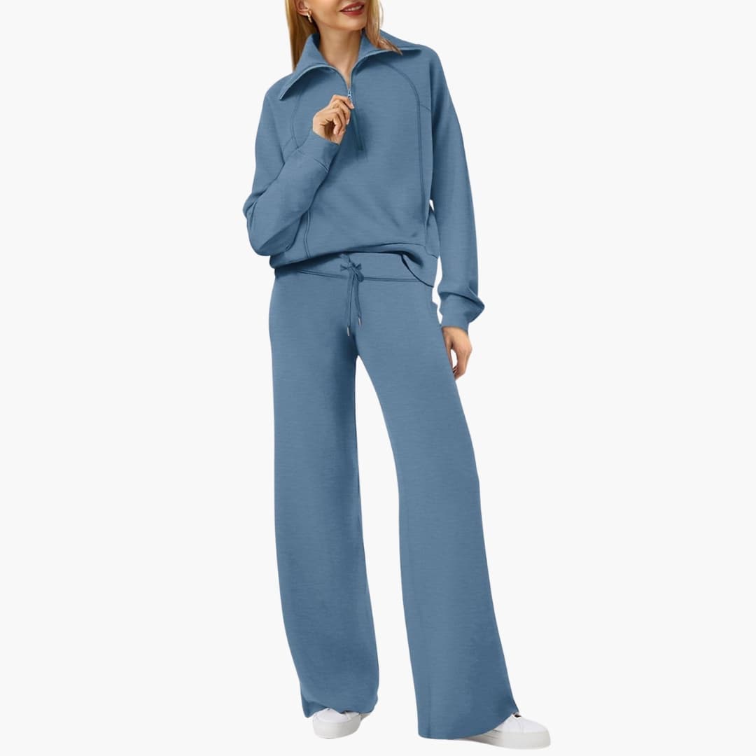 Women's lounge set with half-zip top and wide-leg pants in blue.