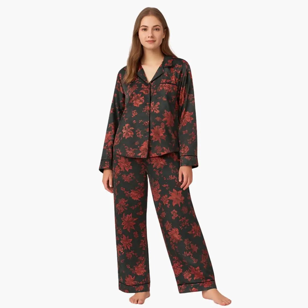 Women's two-piece floral pajama set with dark navy shirt and red floral pants.