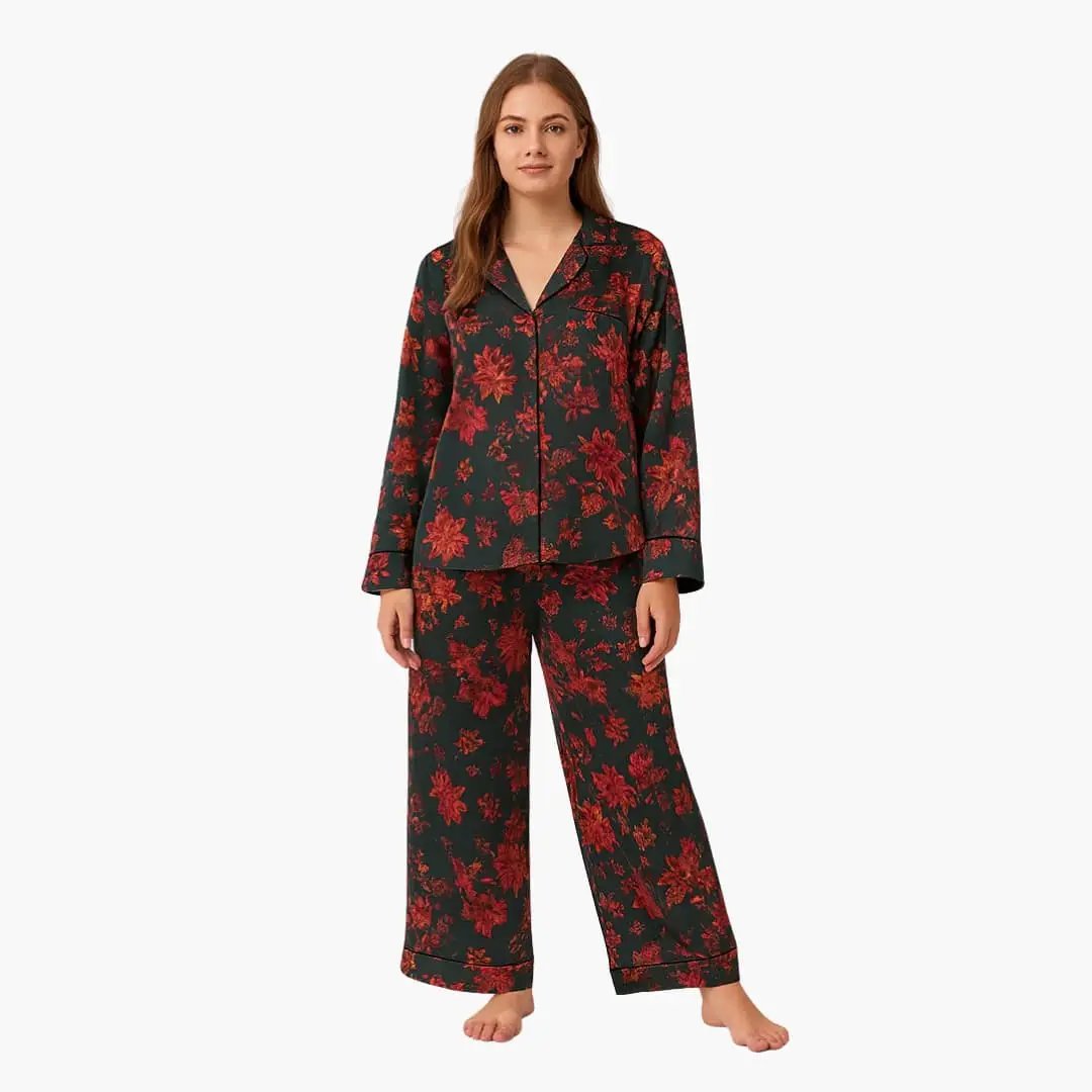 Women's pajama set with floral pattern shirt and pants by Wilfred Smith; dark background.