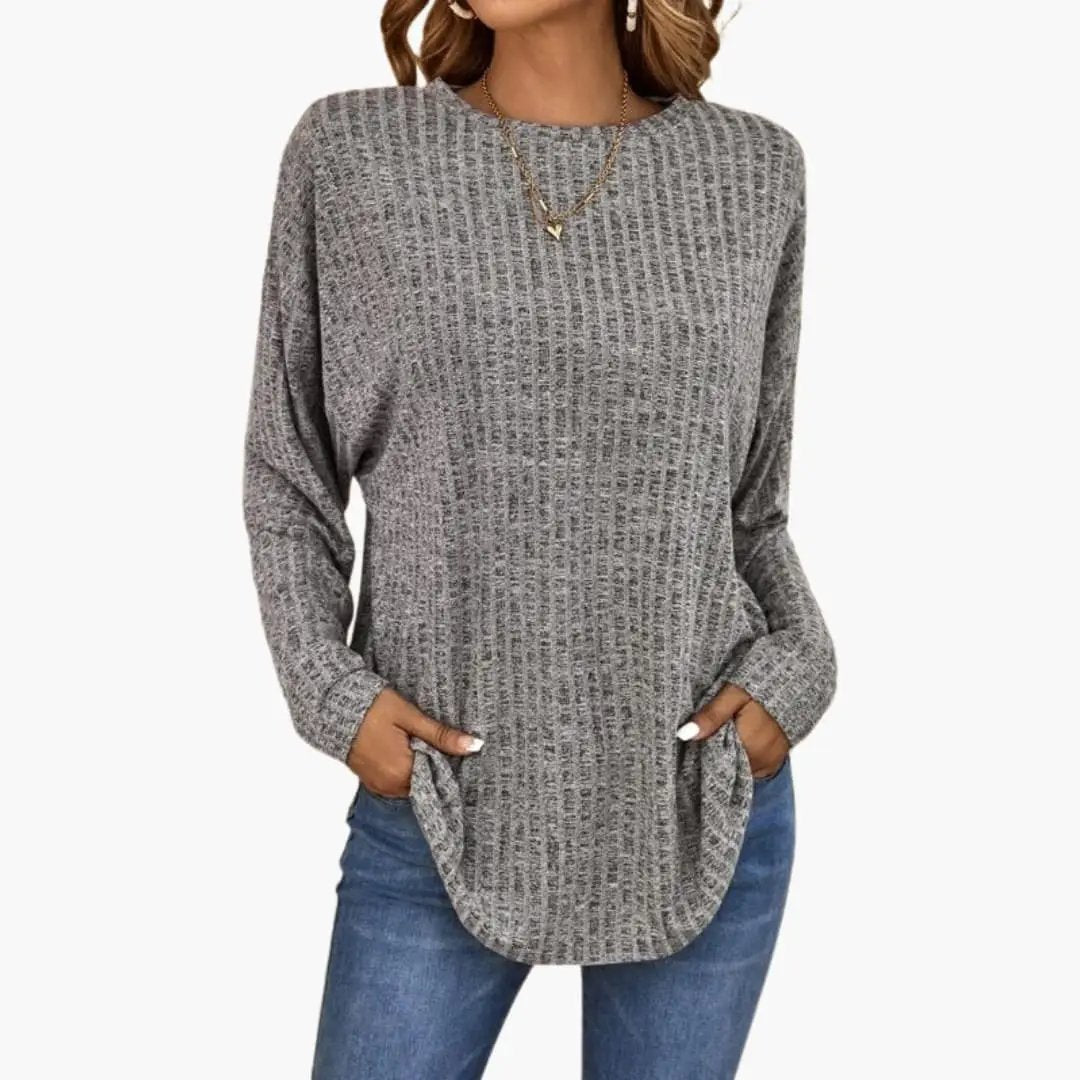 Women's knit sweater with ribbed surface in gray heather, relaxed fit with side pockets.