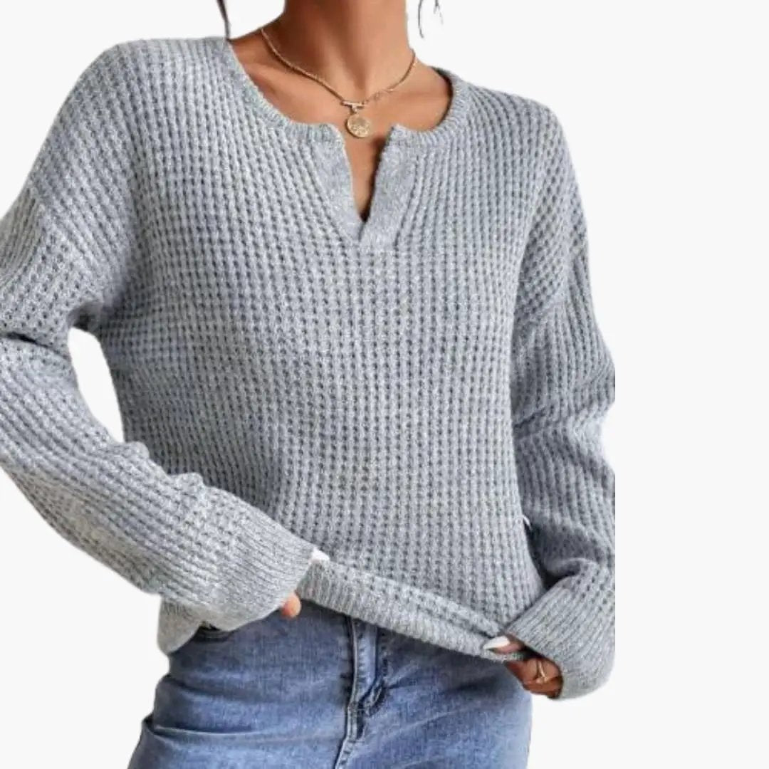 Women's knit sweater with slit neckline in light gray chunky knit, long sleeves
