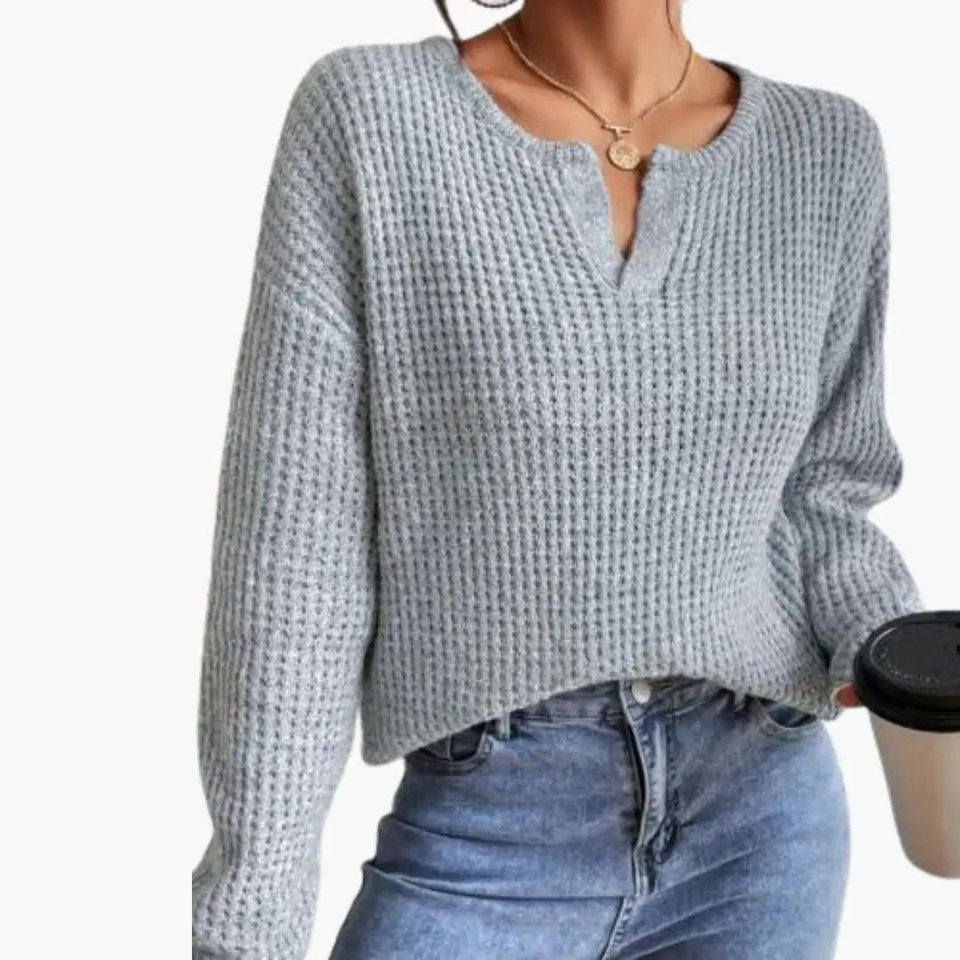 Women's Knit Sweater with Slit Neckline in light gray waffle-knit fabric, styled with jeans.