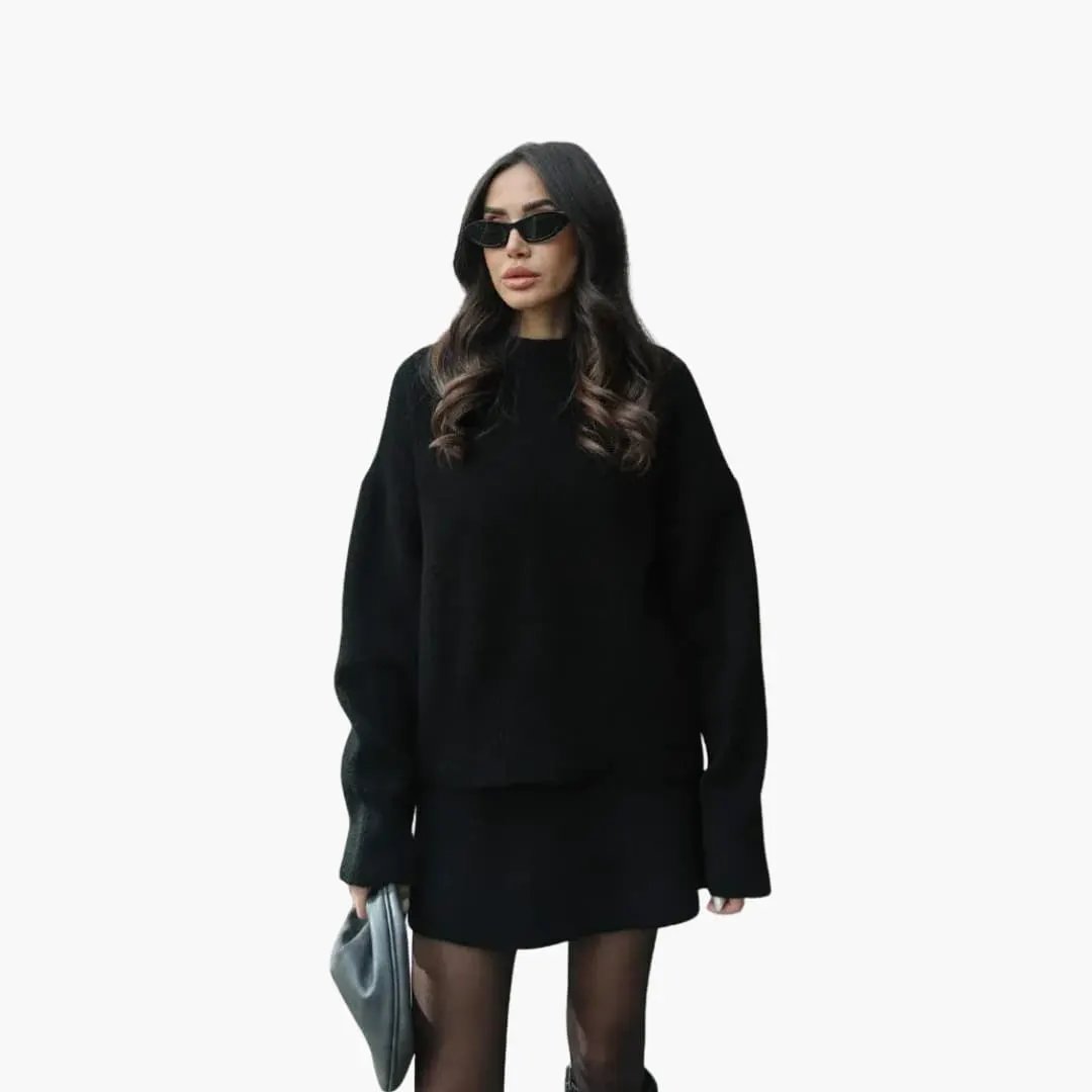Women's two-piece knit set in black with a round-neck sweater and matching skirt