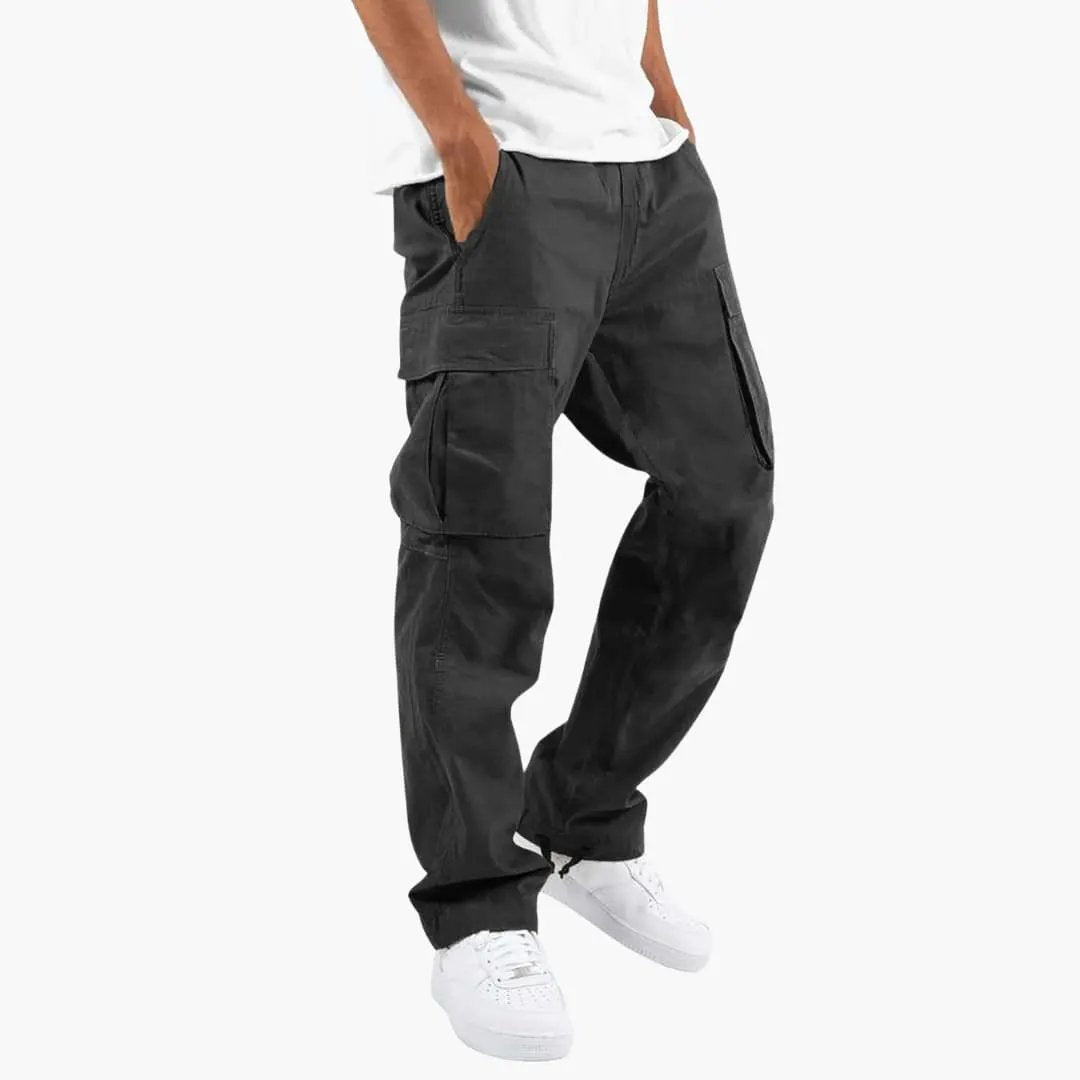 Men's cargo pants with flap pockets in black by Wilfred Smith