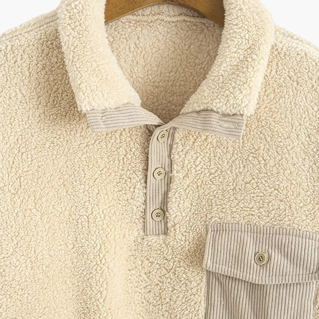 Beige sherpa fleece jacket with polo collar, button placket, and ribbed chest pocket.