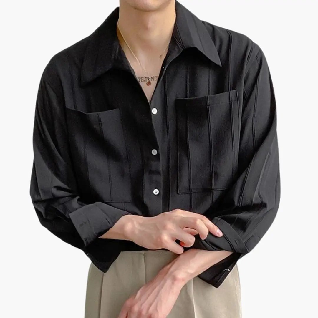 Men's black ribbed-texture shirt with large chest pocket and button-down front.