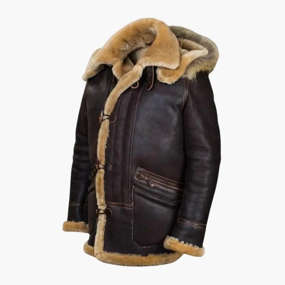 Men's jacket with hood and toggle closure, dark brown leather with beige shearling trim and front zip pockets.