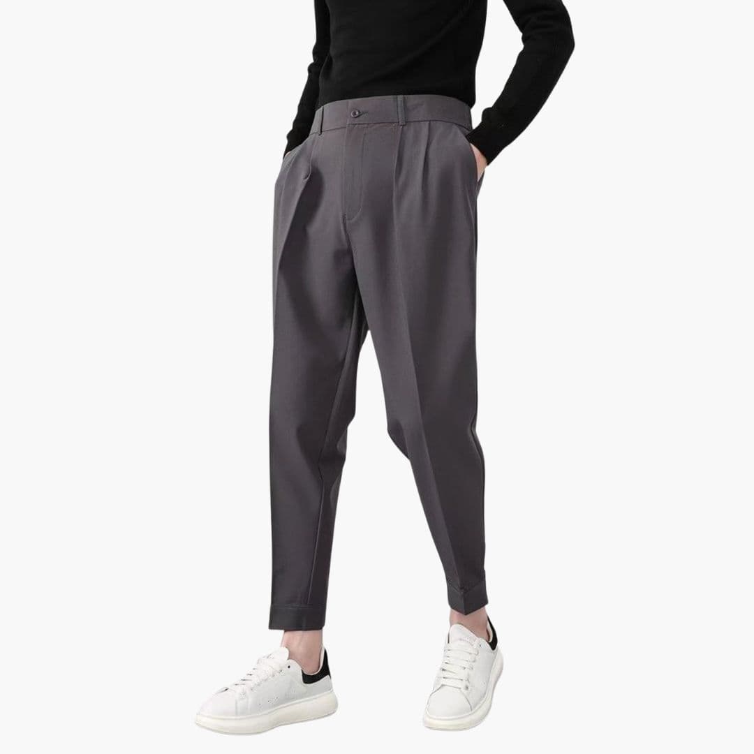 Men's trousers by Wilfred Smith, charcoal gray tapered-fit with button closure and side pockets.