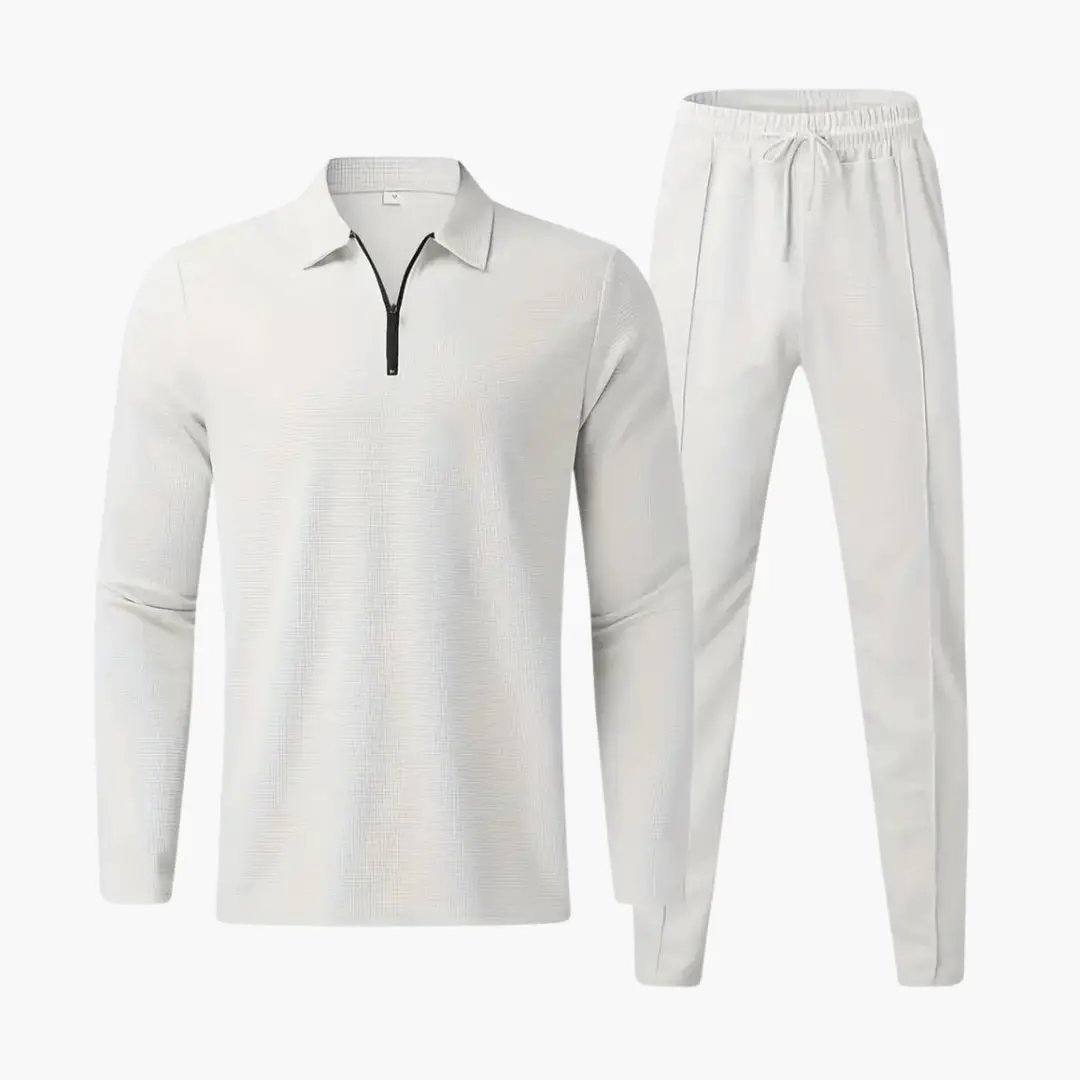 Two-piece men's tracksuit set with quarter-zip top and tapered pants in light gray