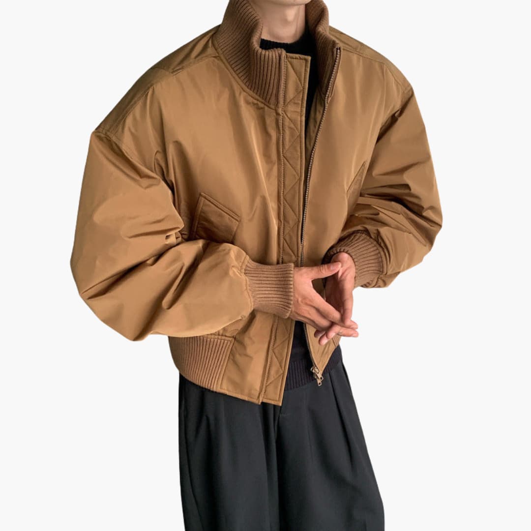 Men’s Bomber Jacket with High Collar in tan, ribbed cuffs and zip front with side pockets.
