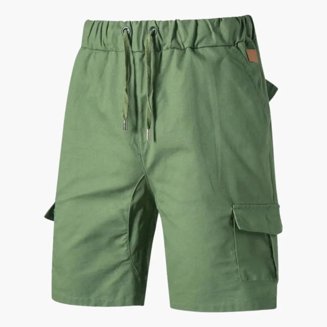 Men's cargo shorts in olive green with drawstring waist and flap pockets by Wilfred Smith.