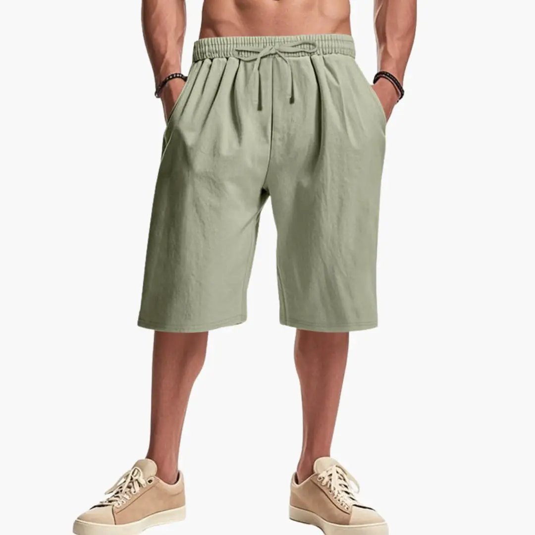 Men’s cargo shorts with elastic waist and drawstring in olive green, front pockets.
