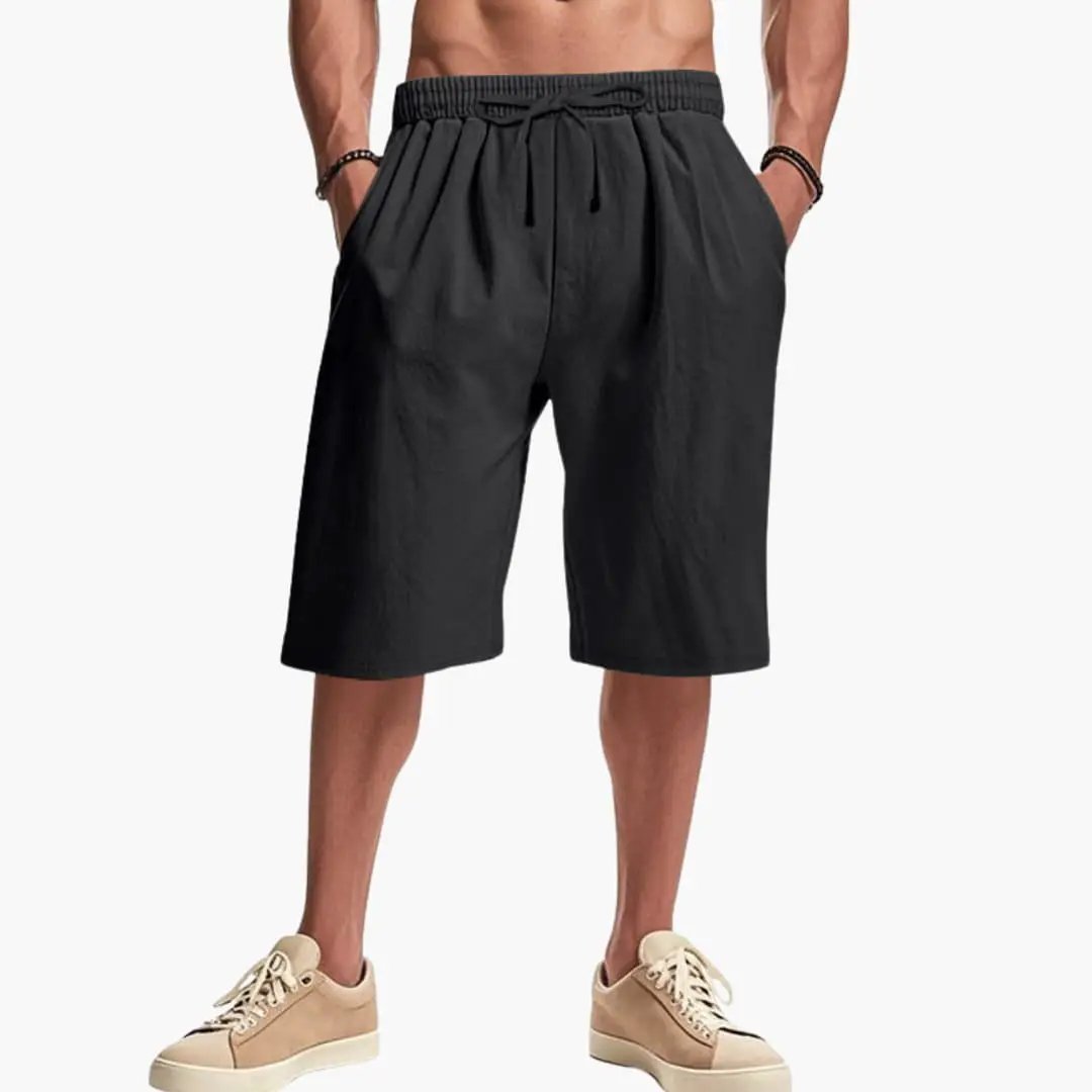 Men’s Cargo Shorts by Wilfred Smith in black with elastic waistband and pockets.