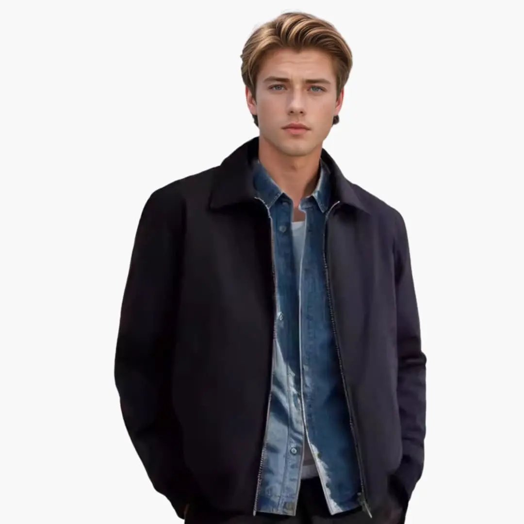 Men's bomber jacket by Wilfred Smith with front zip, black exterior, worn over denim shirt