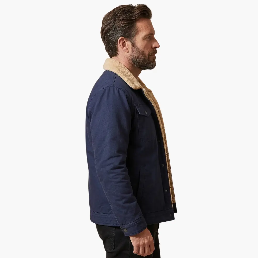 Men's trucker jacket by Wilfred Smith, navy with sherpa lining and button closure.