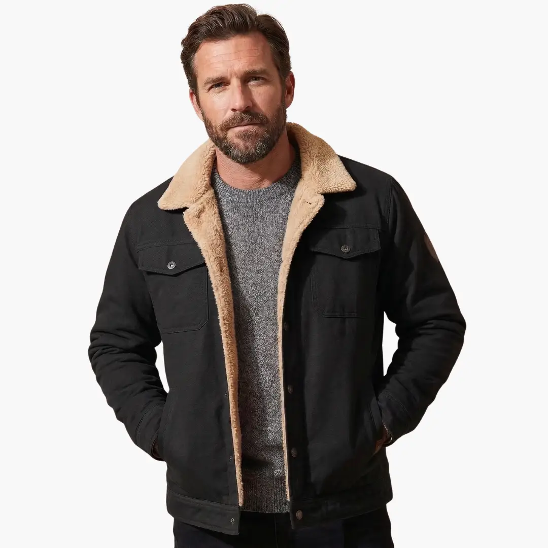 Men's black trucker jacket with tan sherpa lining and button-front closure