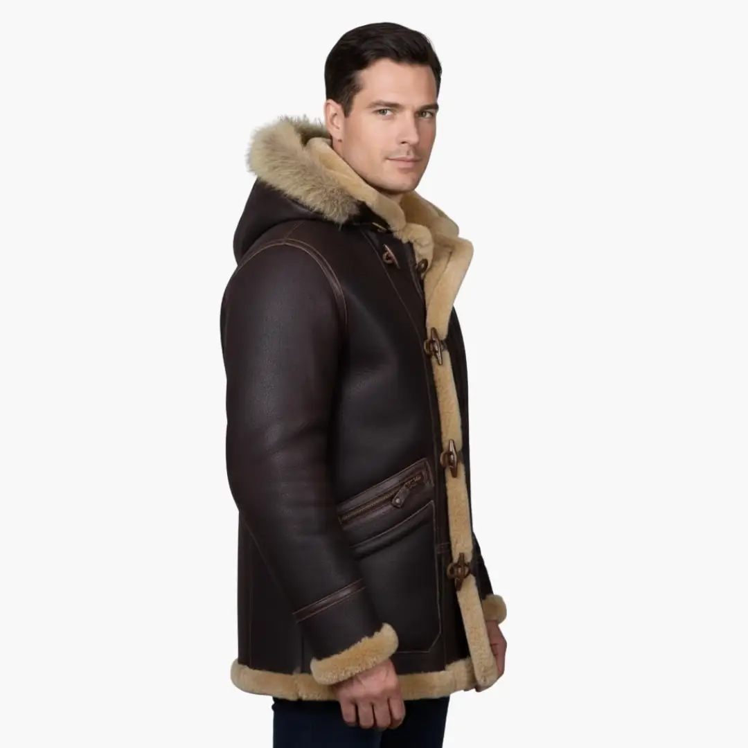 Men's jacket with hood and toggle closure; dark brown leather parka with beige shearling trim.