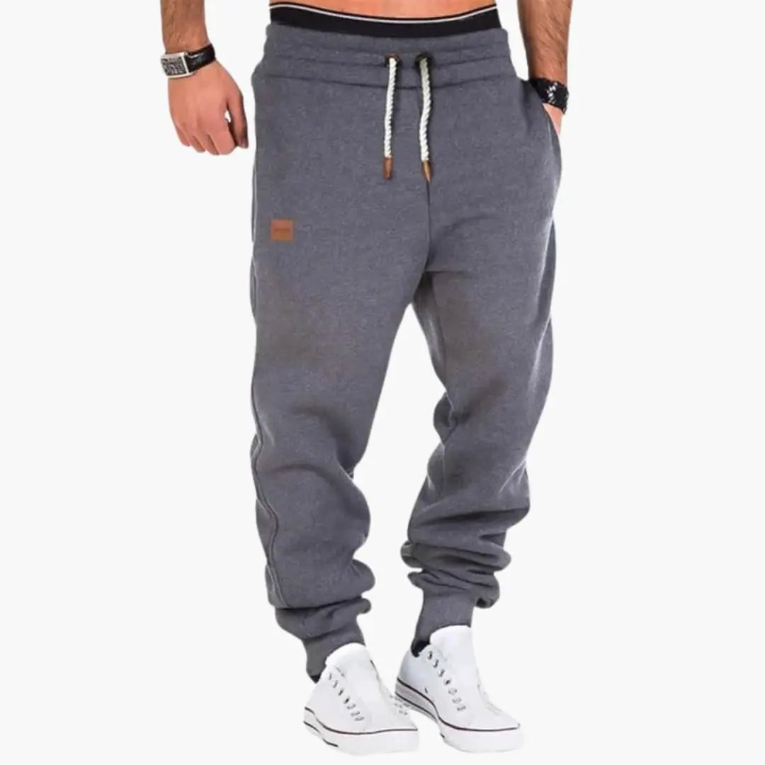 Men’s Jogger Pants in gray with ribbed cuffs, pockets and drawstring by Wilfred Smith