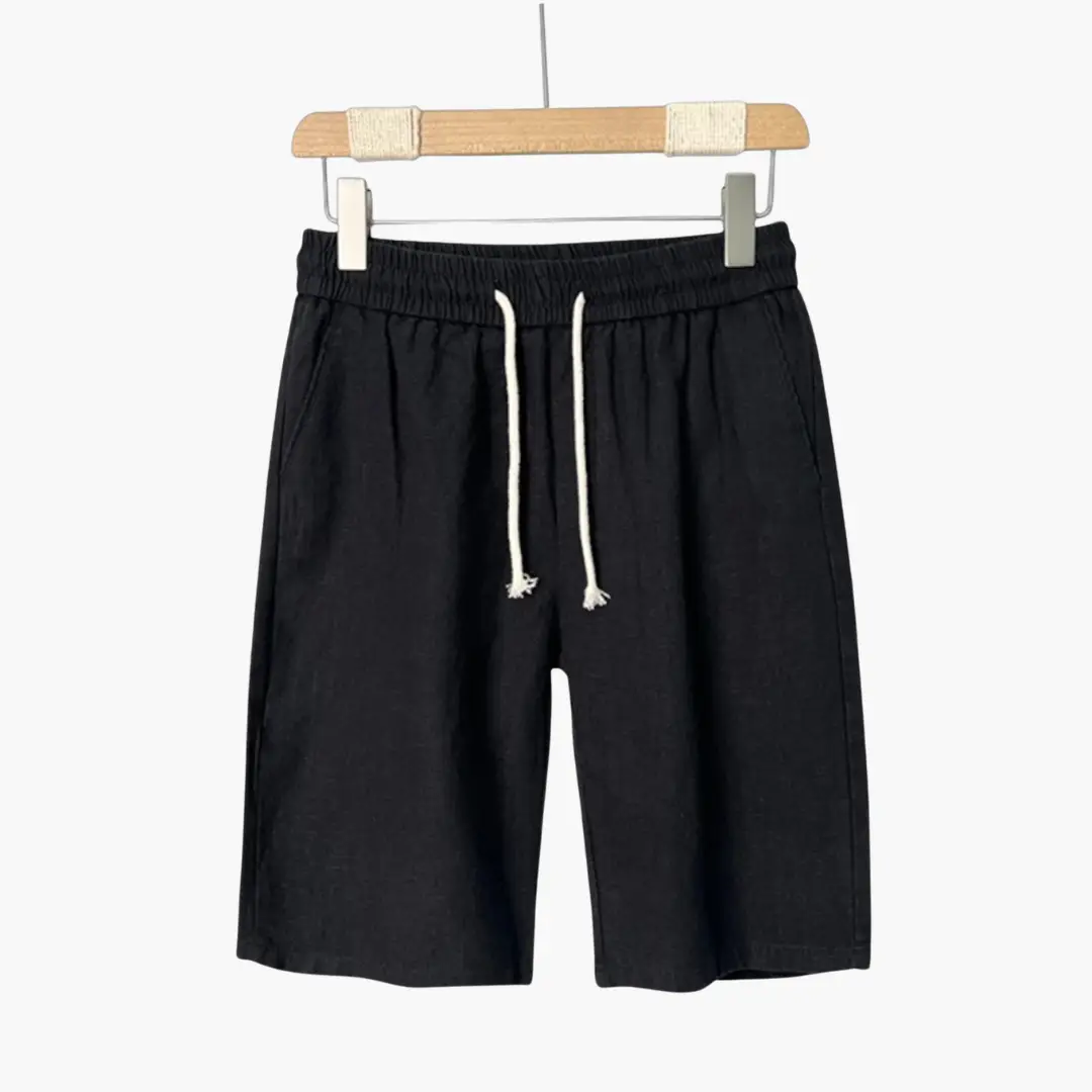 Men's black linen shorts with elastic waistband, white drawstring, and side pockets