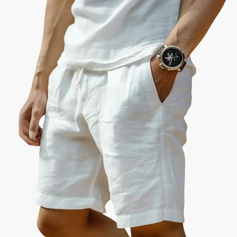 Men's white chino shorts with elastic waistband and drawstring, mid-length.