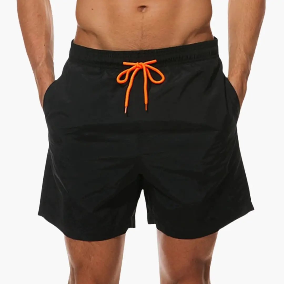 Men's jogger shorts in black with orange drawstring and elastic waistband.