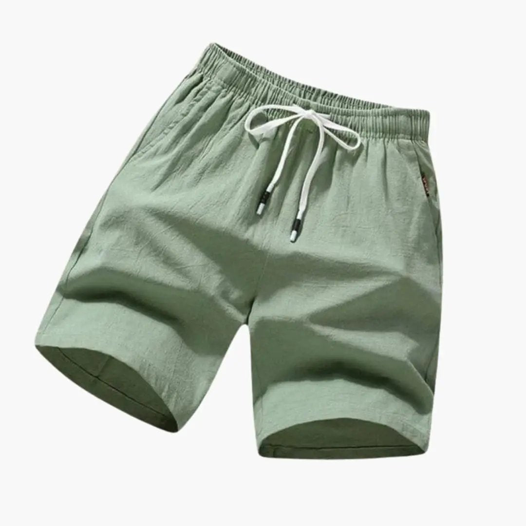 Men's swim shorts by Wilfred Smith with drawstring and side pockets, knee-length, light green