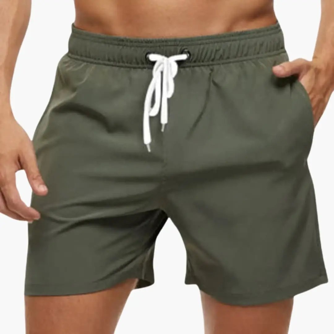 Men’s swim shorts by Wilfred Smith, olive green boardshorts with elastic waistband and quick-drying fabric.