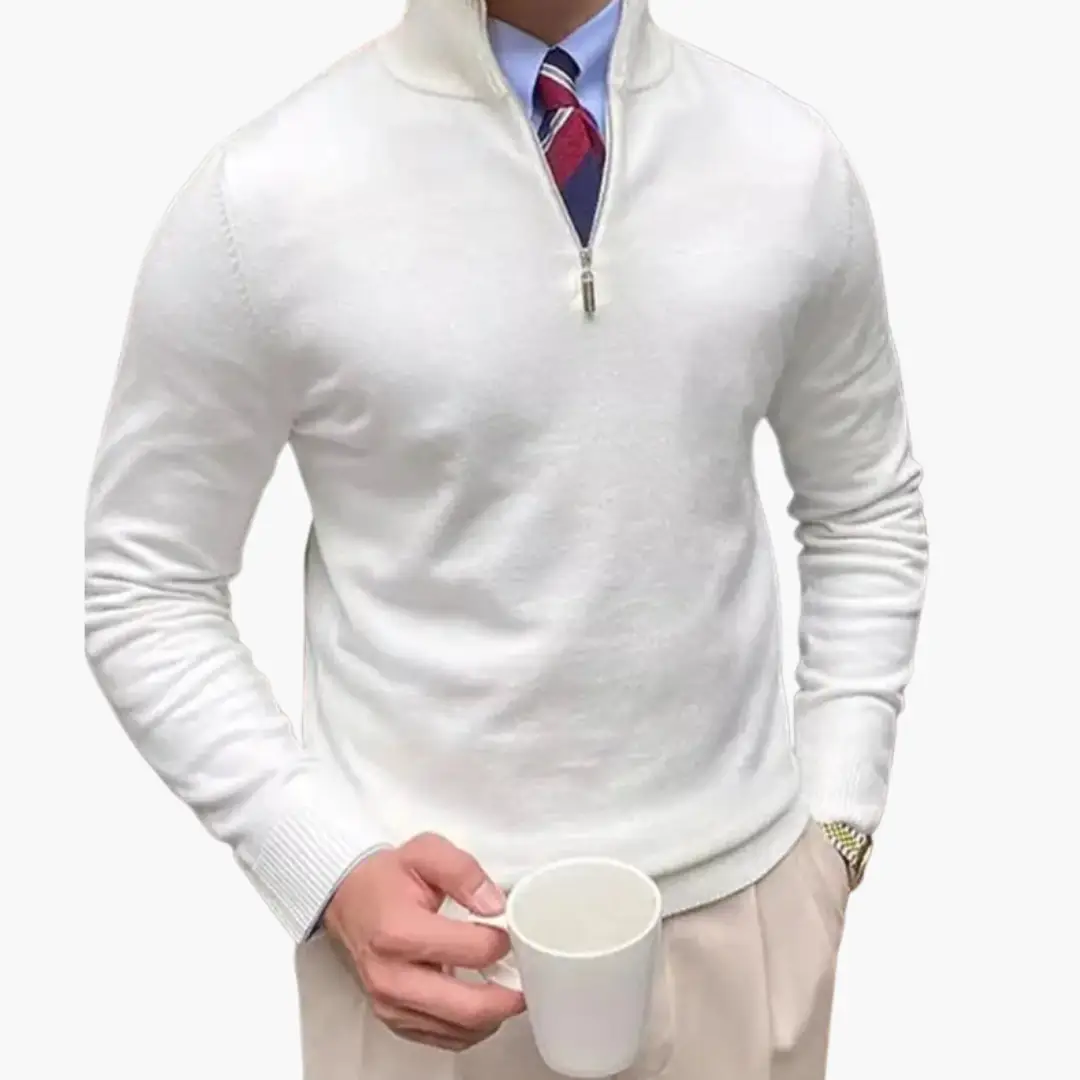 Men's white half-zip jumper with stand collar and ribbed hem, worn over shirt and tie, holding a mug.