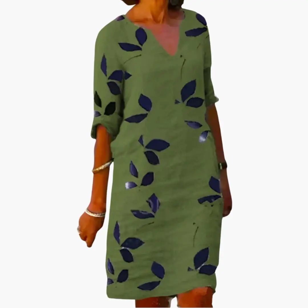 Women’s summer dress in olive green with navy leaf print, V-neck, loose fit.