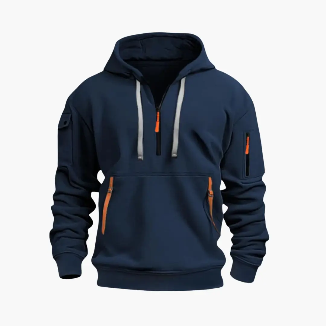 Men’s hoodie Wilfred Smith in navy with adjustable hood, front half-zip with orange pull, and orange-zippered pockets.
