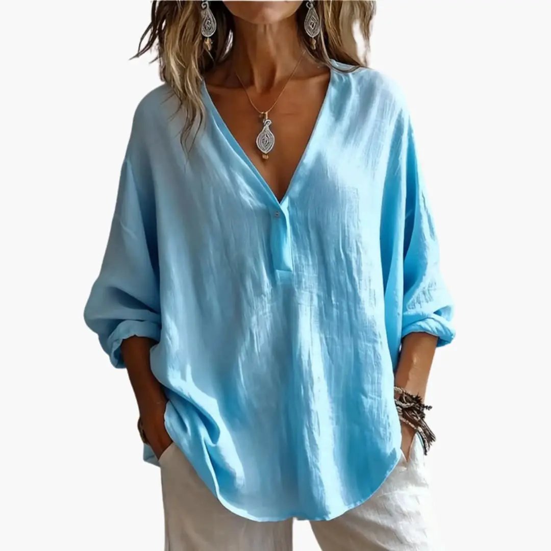 Women's blue blouse with round neckline and long sleeves, lightweight relaxed-fit.