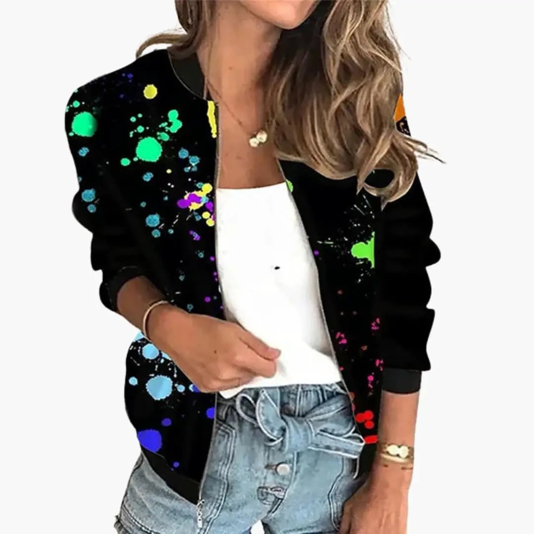 Women’s bomber jacket by Wilfred Smith with black base and vibrant paint-splatter print.