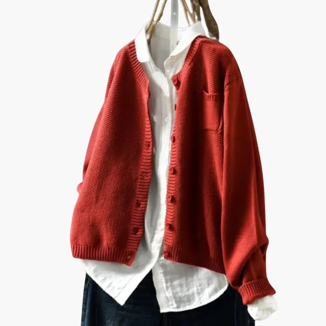 Women's red textured-knit cardigan with chest pocket and button front over a white shirt